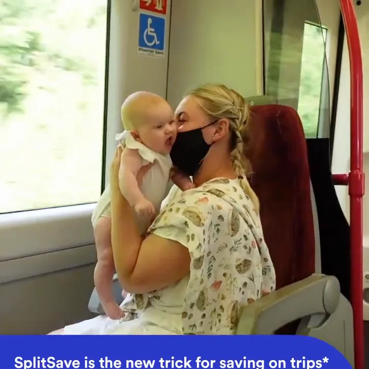 A passenger and baby on a train above a SplitSave campaign caption